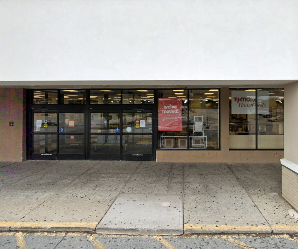 Interior Deluxe Furniture storefront with glass entrance